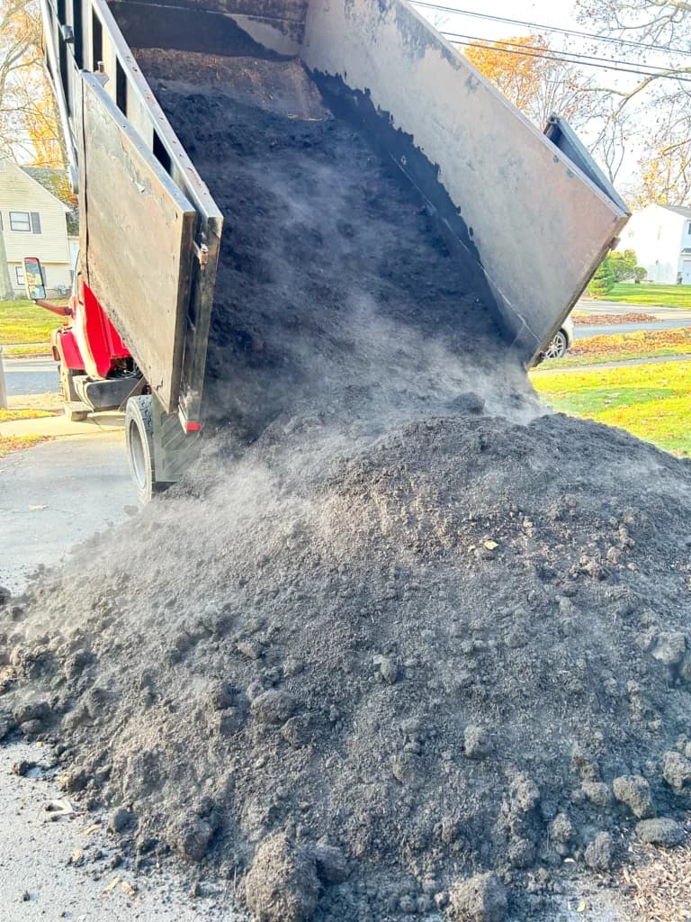 Topsoil delivery being spread